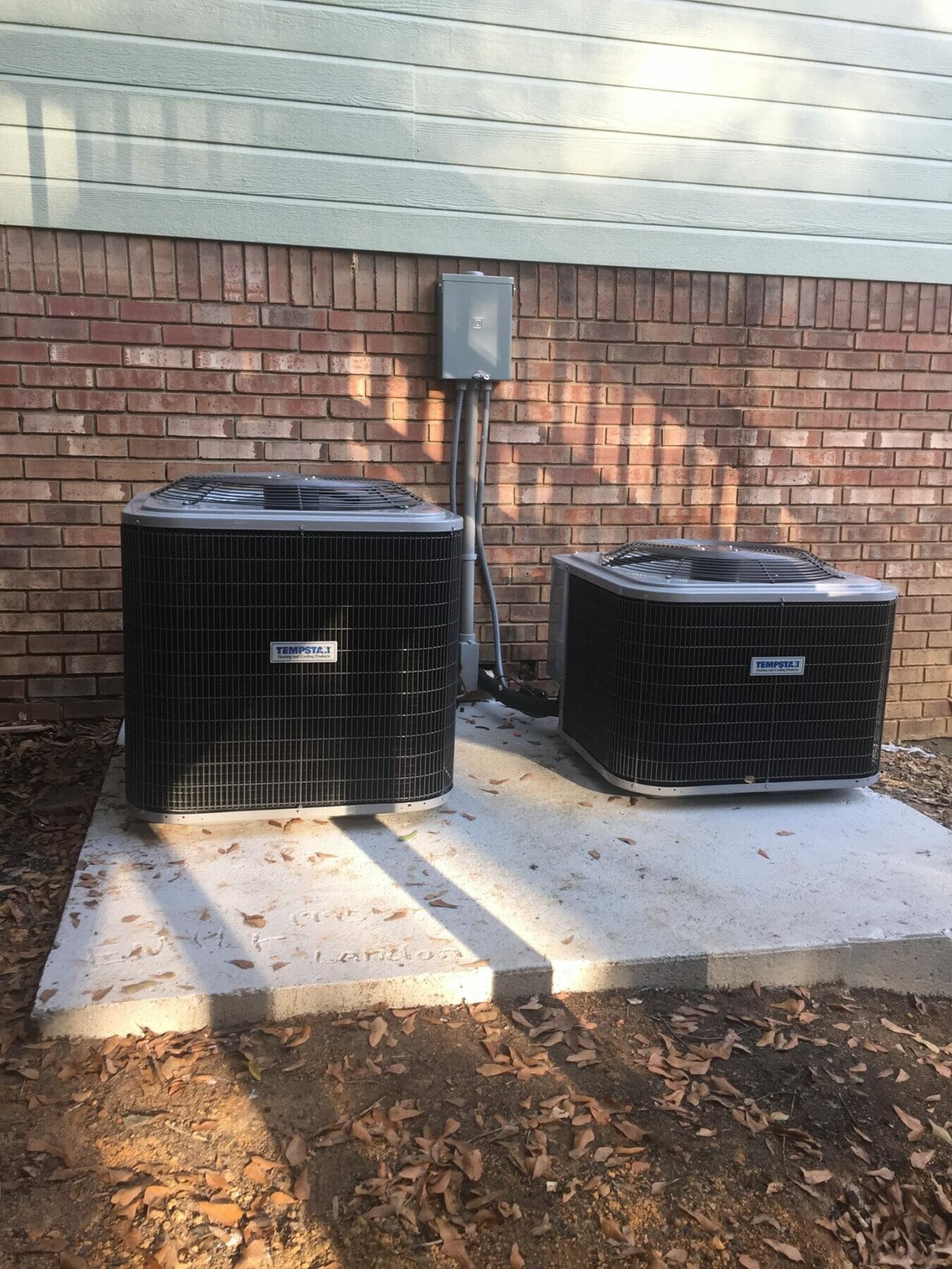 New hvac units on concrete pad